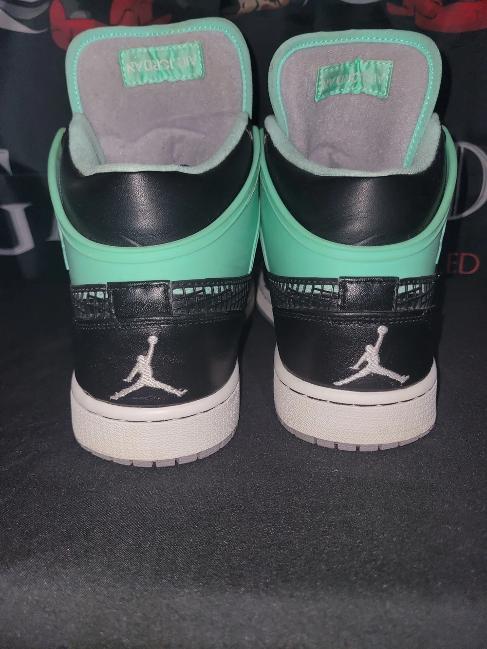 Jordan 1 Retro Black and Mint Green Glow Hi-Top Sneakers